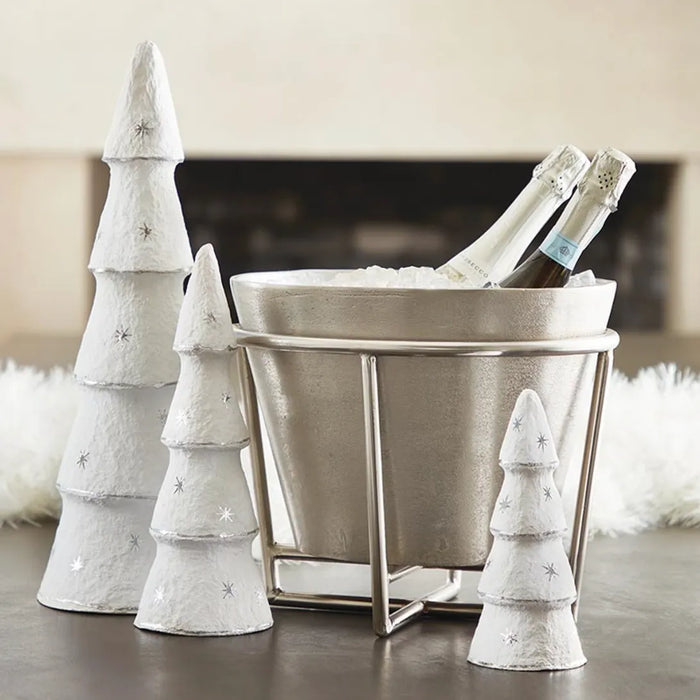 silver champagne bucket holding bottles on ice