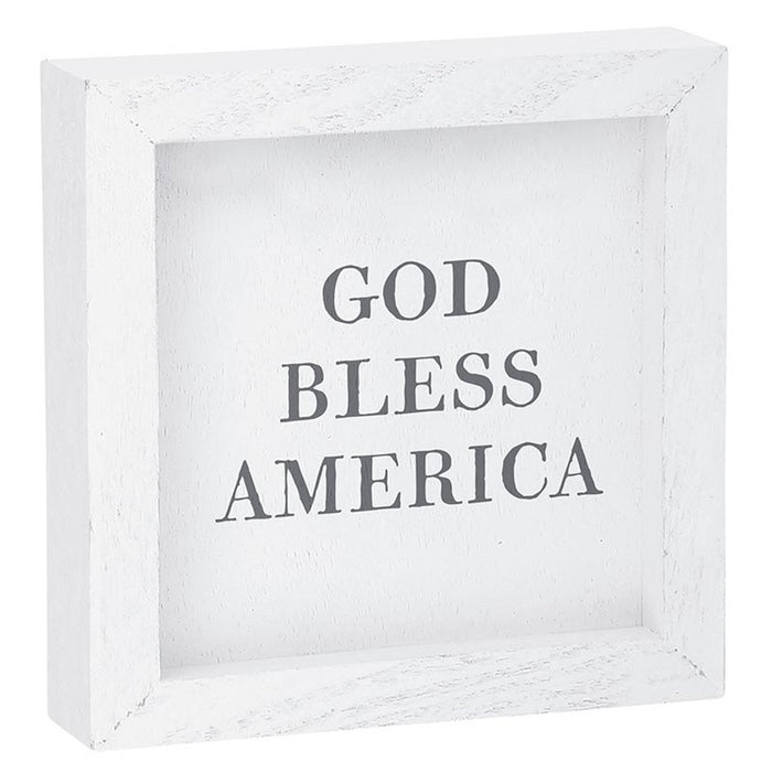 White framed sign with 'GOD BLESS AMERICA' text on a white background