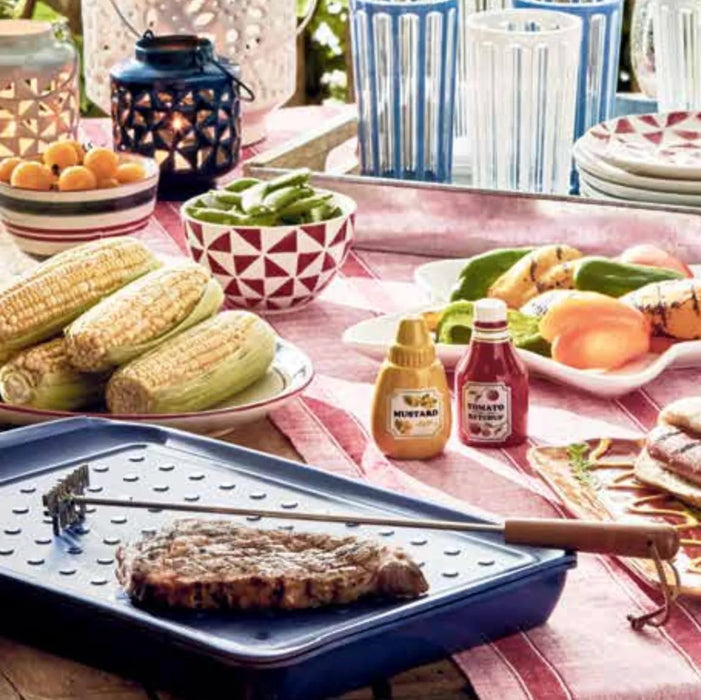 Outdoor table setting with steak branding iron marking steak 