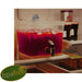 Clear stacking beverage dispensers styled on party table with red drinks