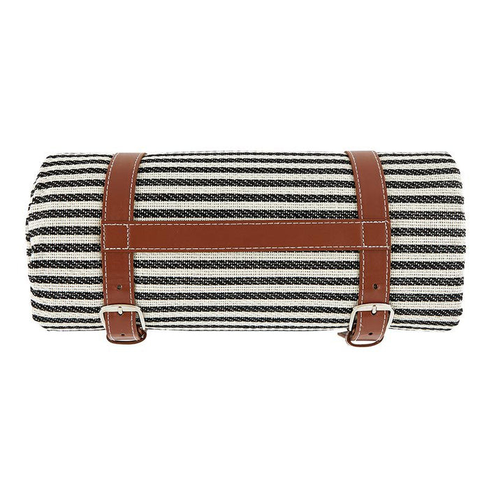 Striped Picnic Blanket — rolled black and white stripe acrylic blanket with tan leather carry straps and buckles, PEVA waterproof backing