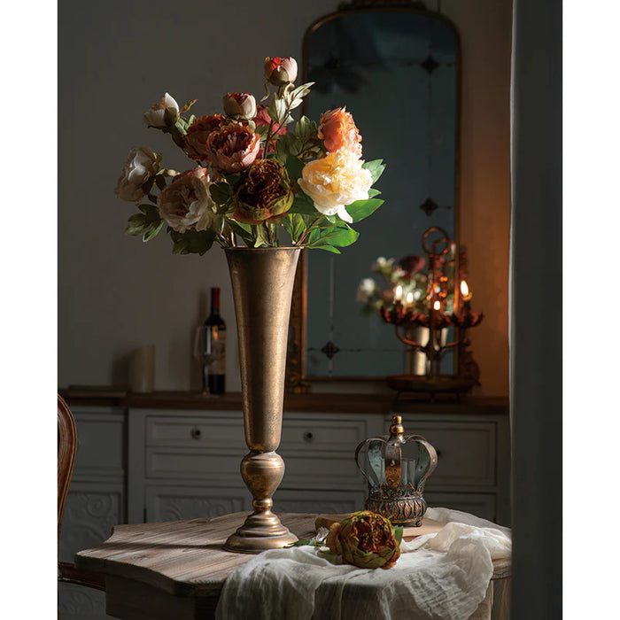 Tall antique gold trumpet vase styled with roses and peonies in elegant room setting (flowers not included)