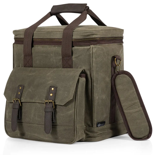 Olive green waxed canvas bag with brown leather straps on a white background