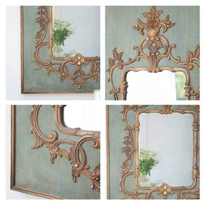 Decorative gold mirror with intricate designs on a light green background