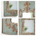 Decorative gold mirror with intricate designs on a light green background