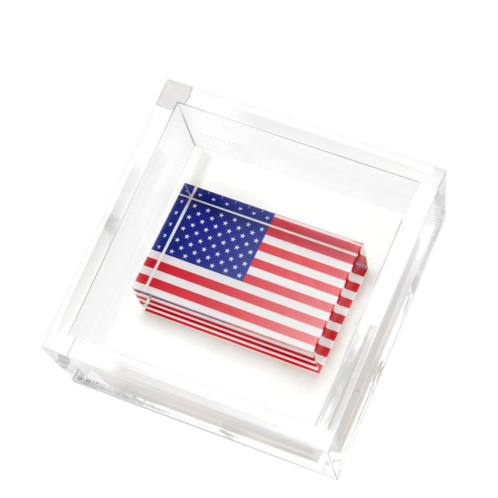 Clear acrylic cocktail napkin holder with an american flag napkin weight