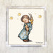 Vintage-style paper napkin featuring a Hummel-inspired illustration of an angelic child holding a candle, surrounded by golden stars, with soft pastel colors and delicate detailing