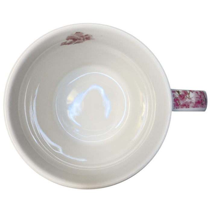 April in Paris Ceramic Mug — top-down interior view showing clean white ceramic with cherry blossom handle detail