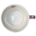 April in Paris Ceramic Mug — top-down interior view showing clean white ceramic with cherry blossom handle detail