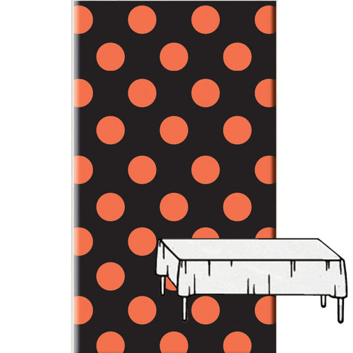 A plastic table cover with a pattern of large orange polka dots on a black background, displayed vertically with a small section unfolded to show the solid white underside.