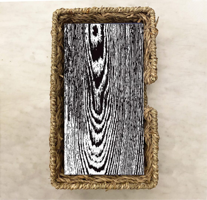 woodgrain guest paper towels with natural variegated wood pattern displayed in a clear holder, neutral napkins for entertaining