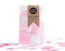 Bright pink, light pink, and white square confetti in clear bag