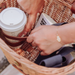 Interior of Cambridge wicker bicycle basket with coffee cup in drink holder strap