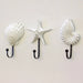 Set of 3 white coastal seashell and starfish wall hooks with black metal hooks