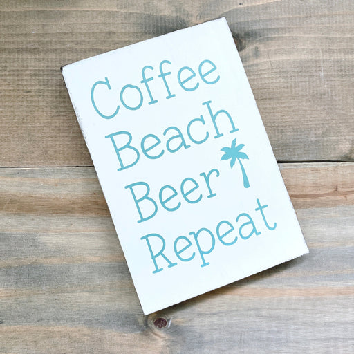 Close up of Coffee Beach Beer Repeat handmade distressed wood sign by Anchored Soul Designs
