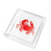 Clear acrylic cocktail napkin holder with a red crab napkin weight
