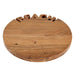 Wooden round sign with 'BEACH' cut out of the top. Handcrafted acacia wood tray with ‘BEACH’ lettering, styled with summer appetizers and coastal table accessories.