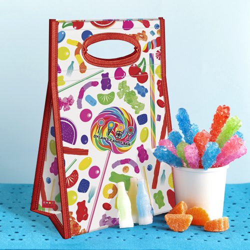 Dylan's Candy Bar insulated lunch tote with colorful candy print, shown with rock candy and gummy candy