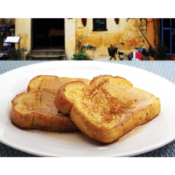 French toast slices imprinted with Eiffel Tower design on a white plate