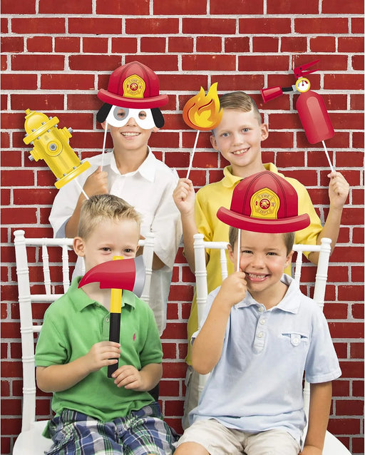 Red brick backdrop for kids firefighter photo booth with fire truck props