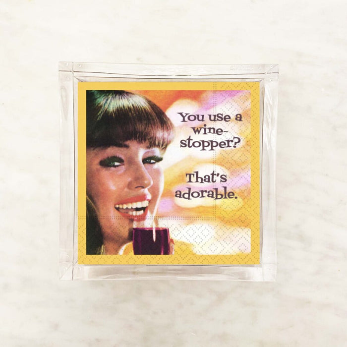Wine stopper cocktail napkins featuring an image of a woman with a wine glass and text conversation.