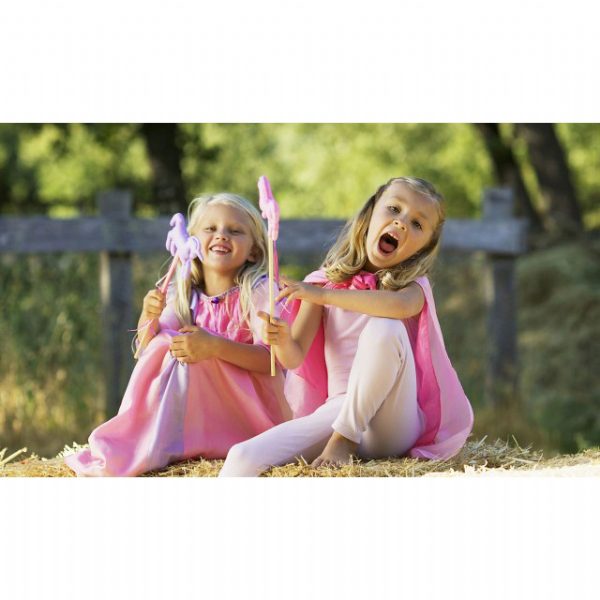 Girls wearing pink playsilk as cape — eco-friendly kids dress-up toy from Modern Lola