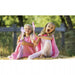 Girls wearing pink playsilk as cape — eco-friendly kids dress-up toy from Modern Lola