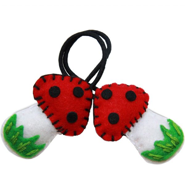Handmade felt mushroom ponytail bands in red and white – girls hair accessory from Modern Lola