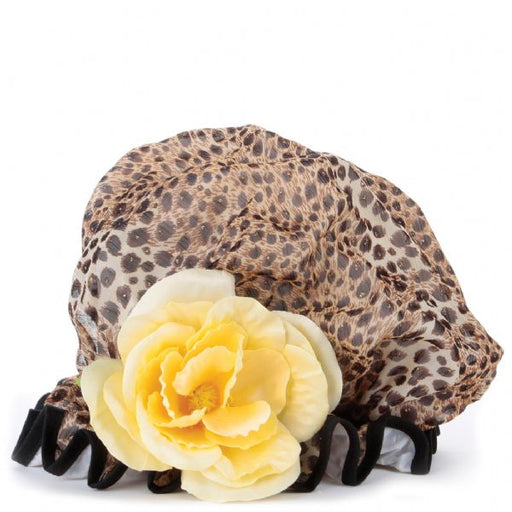 A leopard print shower cap with a large cream flower and black binding.
