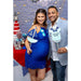 Expecting couple at nautical baby shower holding custom Captain onesie and sailboat photo booth props