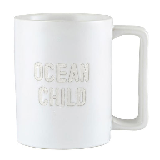 Matte white ceramic Ocean Child mug with debossed lettering and square handle