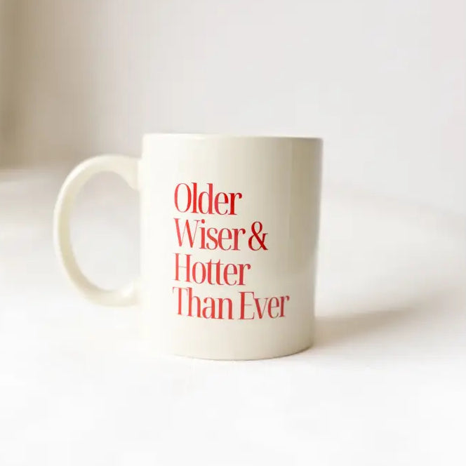 White mug with red text 'Older, Wiser & Hotter Than Ever' on a white background
