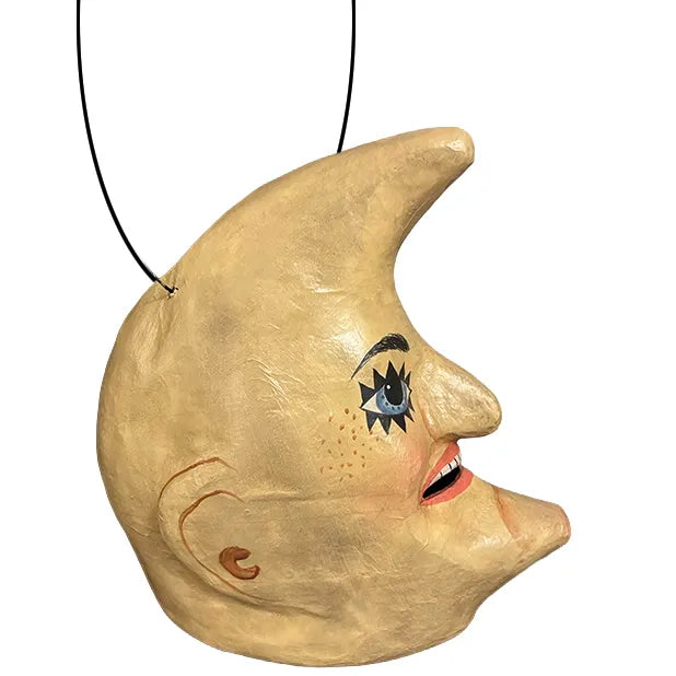 Vintage-style paper mâché crescent moon Halloween bucket with blue eyes, rosy cheeks, and aged cream and gold finish