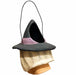 A whimsical, handcrafted papier-mâché witch bucket with a black wire handle. 