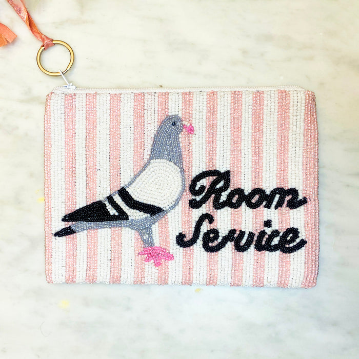 Pigeon Room Service Beaded Coin Purse — front view showing pigeon and Room Service beaded design on pink stripe background