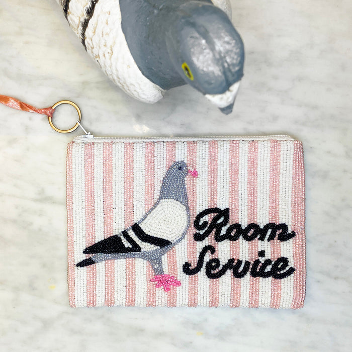 Pigeon Room Service Beaded Coin Purse — styled with pigeon figurine, showing front beaded design detail
