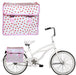 Pink and red polka dot waterproof dual pannier bicycle bag on rear rack