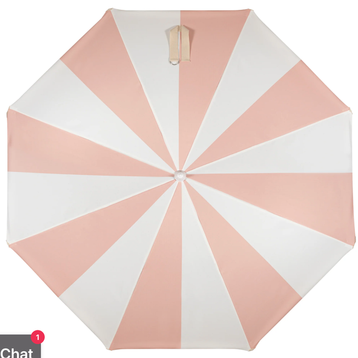 Pink and white striped umbrella on a white background