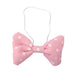 Pink bow tie with white polka dots on a white background
