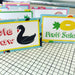 Colorful pool floaty food tents with swan and fruit salad designs