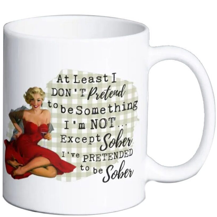 White ceramic mug with vintage pin-up style artwork and the phrase Pretend To Be Sober printed on the front.