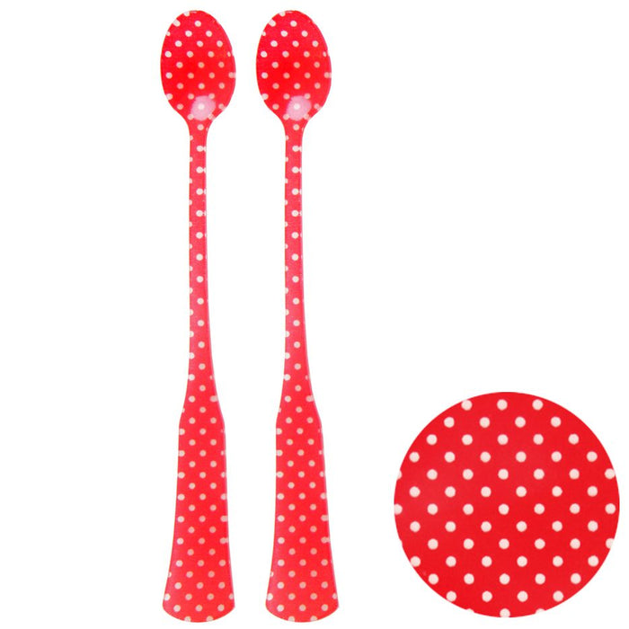 A pair of red acrylic spoons with white polka dots design, displayed against a white background.