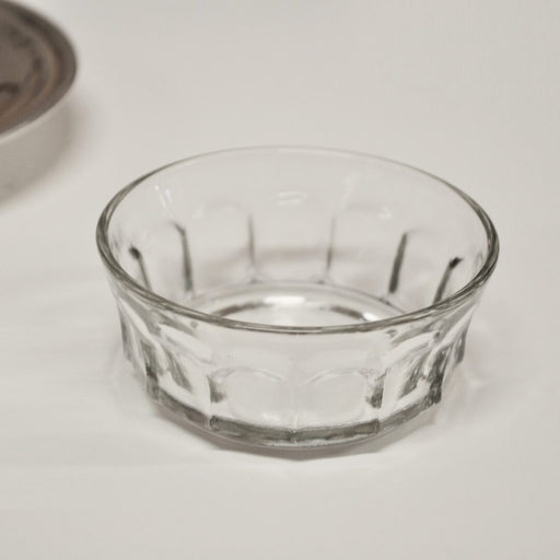 Silver Butter Dish — close-up of clear glass insert dish with faceted sides