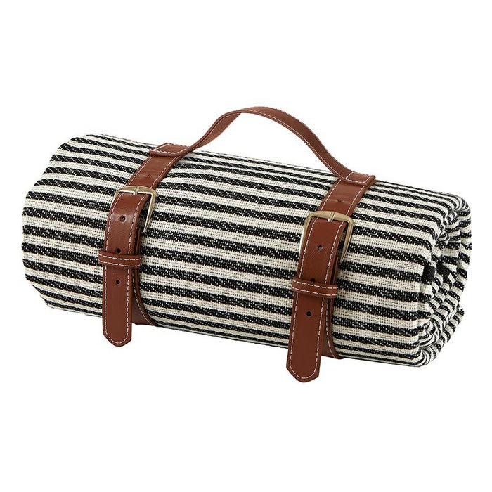 Striped Picnic Blanket — rolled black and white stripe acrylic blanket with tan leather carry straps and buckles, PEVA waterproof backing