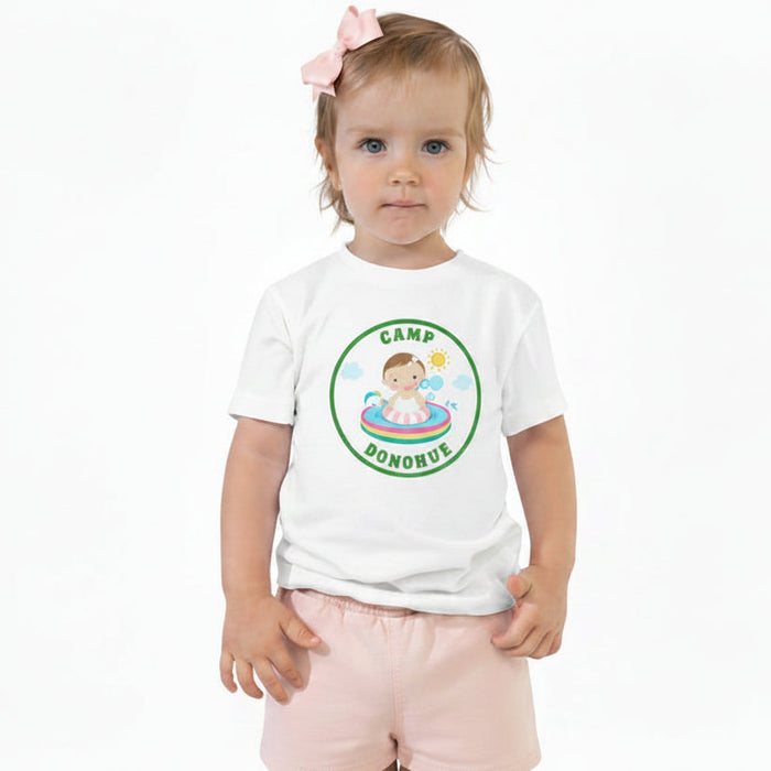 Toddler girl wearing white personalized camp t-shirt with custom camp name design