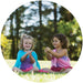 Two girls playing with colorful playsilks outside — imaginative play toys Modern Lola