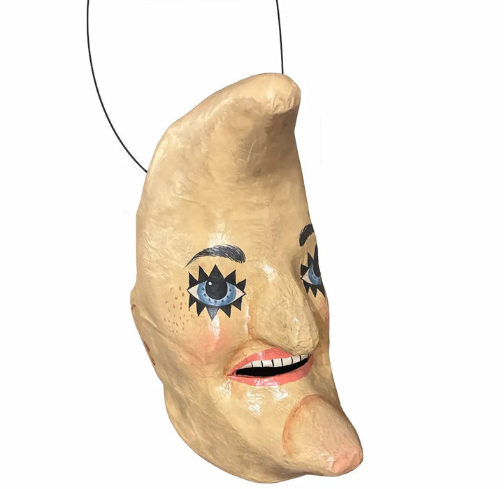 Vintage-style paper mâché crescent moon Halloween bucket with blue eyes, rosy cheeks, and aged cream and gold finish