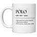 A white ceramic mug with black printed dictionary-style text reading 'POLO / poh - loh / noun' and a definition, held in a person's hand against a plain white background.