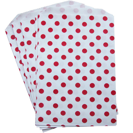A set of 20 white treat bags with red polka dots.
