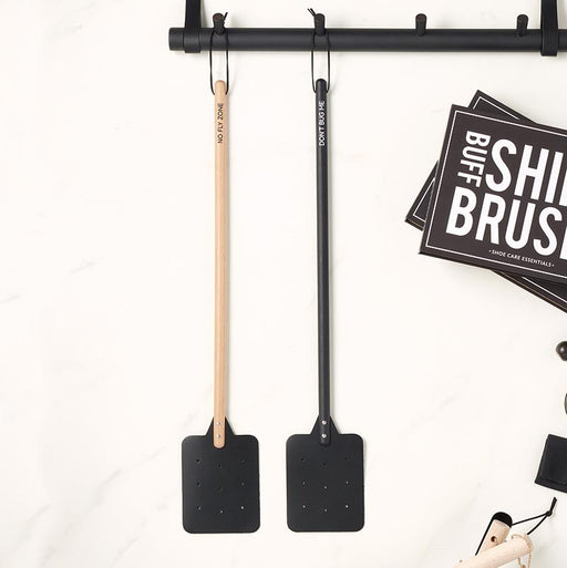Black Don’t Bug Me fly swatter with leather head and hanging loop